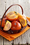 persimmon fruit whole and sliced