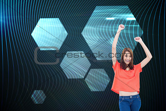 Composite image of laughing teenage wearing casual clothes while raising her arms