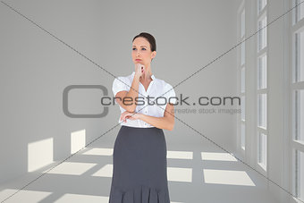 Composite image of pensive elegant businesswoman posing