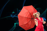 Composite image of smiling blonde holding umbrella