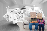 Composite image of silly employees with arms folded wearing boxes on their heads