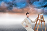 Composite image of smiling businesswoman climbing the career ladder