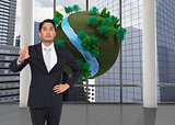 Composite image of unsmiling asian businessman pointing