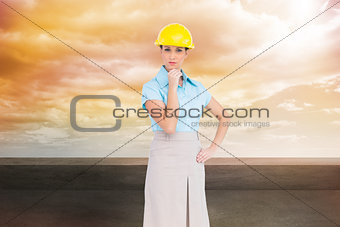 Composite image of thoughtful attractive architect posing