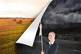 Composite image of businesswoman pulling a chain