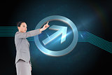Composite image of unsmiling asian businesswoman pointing
