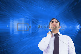 Composite image of businessman standing holding his jacket