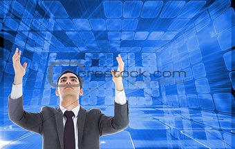 Composite image of unsmiling businessman with arms raised