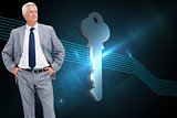 Composite image of man in a suit with his hands on his hips