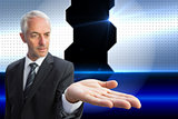 Composite image of concentrated businessman with palm up