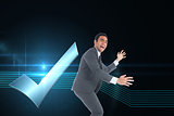 Composite image of happy businessman catching