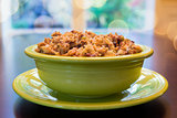 Turkey Stuffing in Green Bowl with Bokeh Background