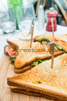Sandwich with chicken, cheese and golden French fries