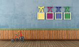 Blue vintage play room with tricycle