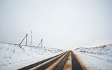 Country winter road and power line