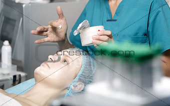 Woman being prepped in a skincare clinic