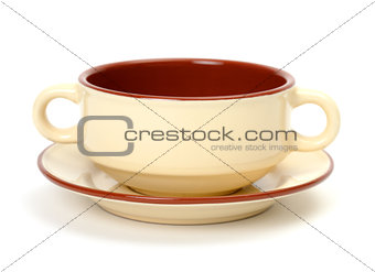 Cup of soup on a plate