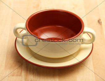 Cup of soup on a plate