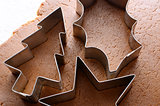 Festive cookie cutters on gingerbread dough