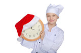 Smiling Christmas young chef  with dial