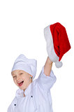 Cheerful chef girl with Santa hat