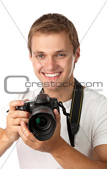 Portrait of a handsome young man holding a camera