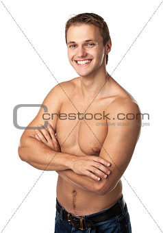 Cute smiling young guy in jeans with bare torso