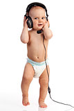 Portrait of a cute one-year old boy wearing a headset