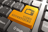 Video Advertising on Orange Keyboard Button.
