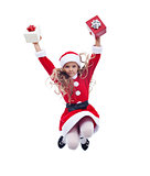 Little santa claus girl jumping high with presents