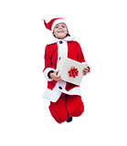 Santa Claus boy holding gift box and jumping with joy