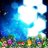 Christmas background with Christmas tree branch decorated with glass balls.