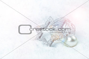 silver xmas decoration on snow