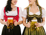Women with dirndl and Oktoberfest beer