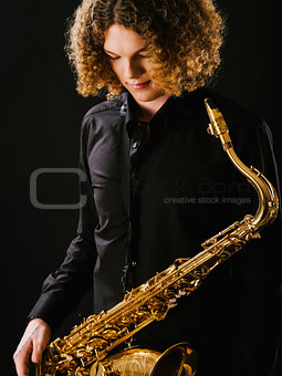 Young man and his saxophone