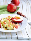 Fruit dessert with peaches, almonds and honey