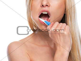 Closeup on teenage girl brushing teeth