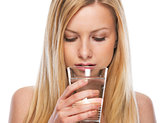 Portrait of teenage girl drinking water