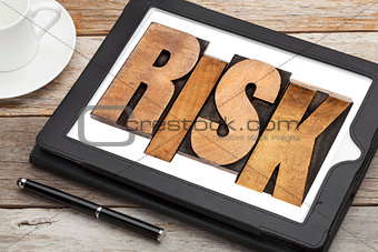 risk - word on digital tablet