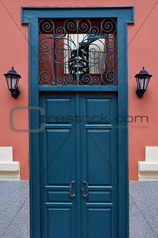 blue door with antique iron pattern