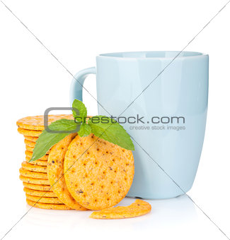 Stack of crackers with mint and cup of drink