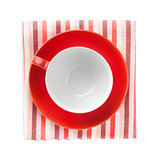 Red coffee cup over kitchen towel