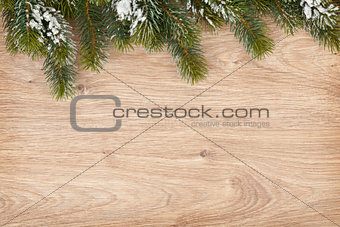 Christmas fir tree on wooden board
