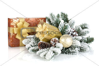 Gift boxes and christmas decor with snowy fir tree