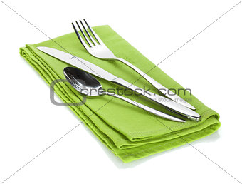 Silverware or flatware set of fork, spoon and knife on towel