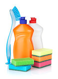 Plastic bottles of cleaning products, sponges and brush