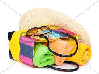 Bag with towels, sunglasses and hat