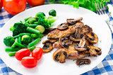 Grilled steak with mushrooms and vegetables