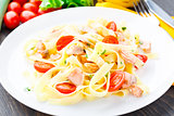 Delicious fettuccini with salmon and tomatoes