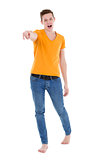 Young man wearing a yellow T-shirt and slim jeans
